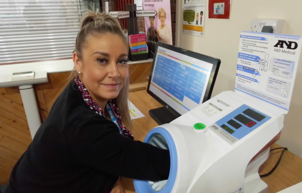 A member of staff using the surgery pod