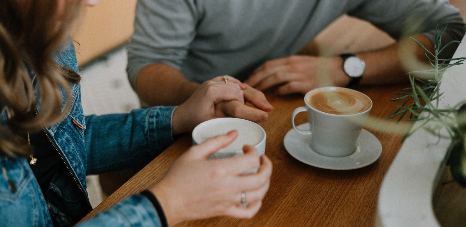 two mugs with coffee on table